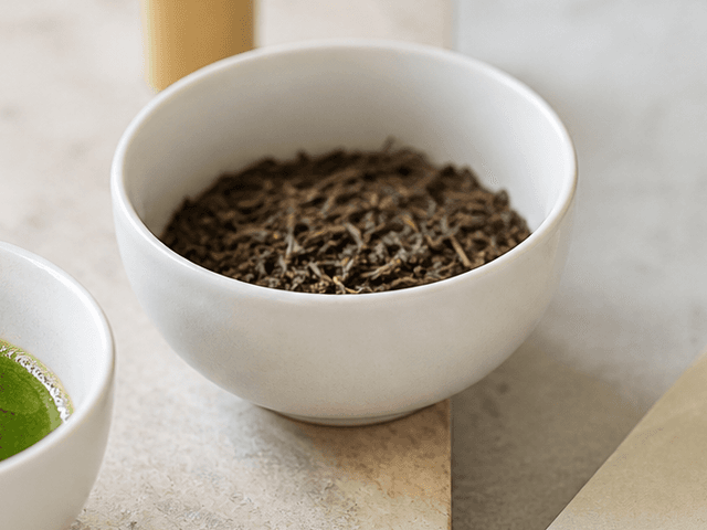 Roasted Japanese tea leaves in a ceramic bowl